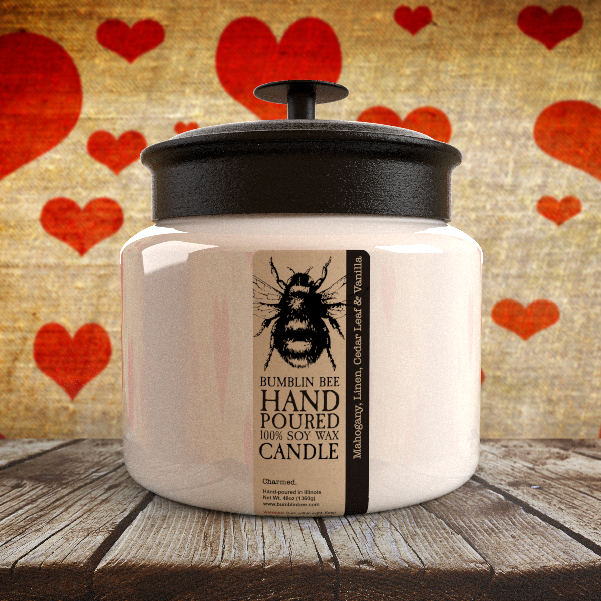 Hand poured Bumblin Bee 48oz triple wick candle with a metal black lid, set against a rustic wooden surface with red heart shapes.